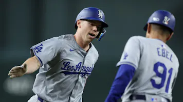 Will Smith of the Los Angeles Dodgers high-fives his third base coach after hitting a solo home run against the Arizona Diamondbacks, and we offer our top Braves vs. Dodgers player props and expert picks based on the best MLB odds.