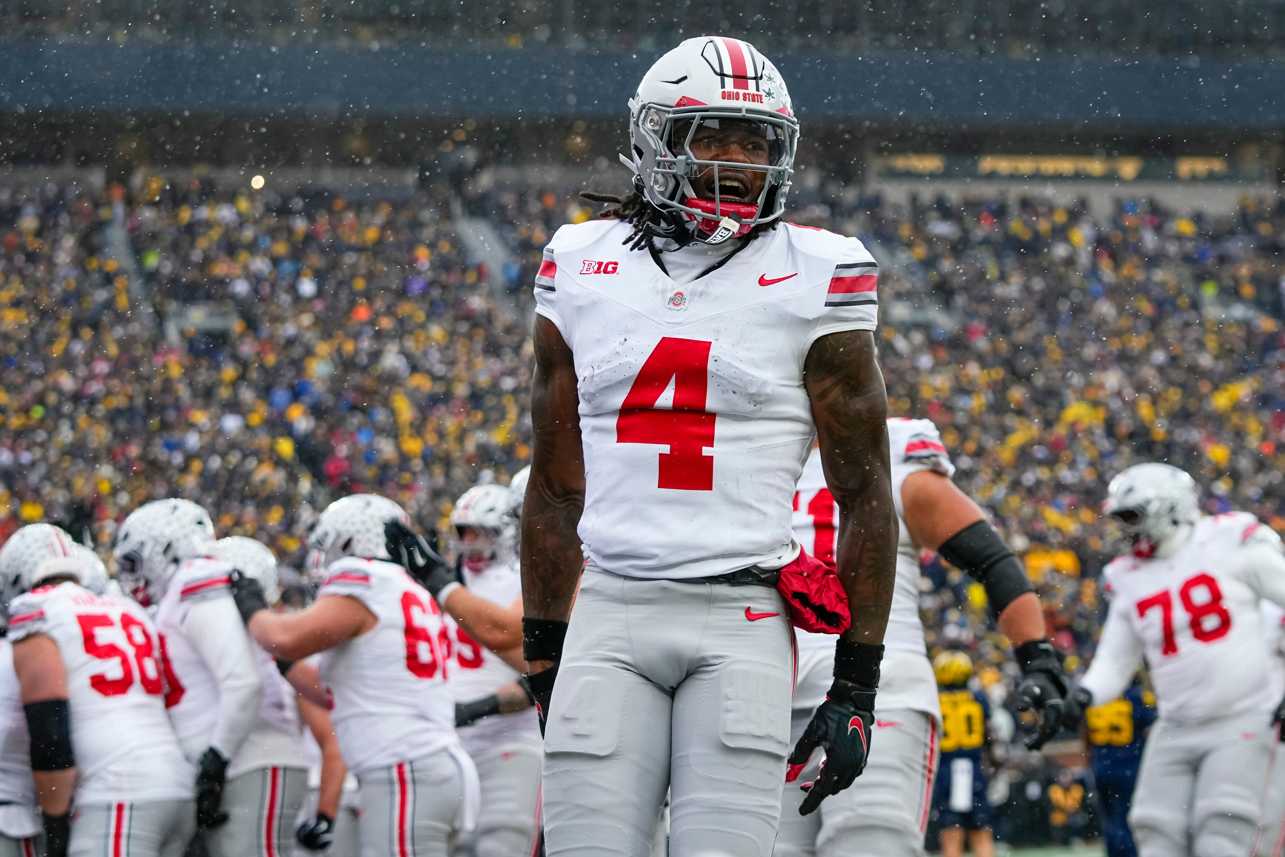Ohio State Buckeyes wide receiver Jeremiah Smith (4) runs the ball in for a touchdown as he is featured in our Miami vs. Ohio State same-game parlay.