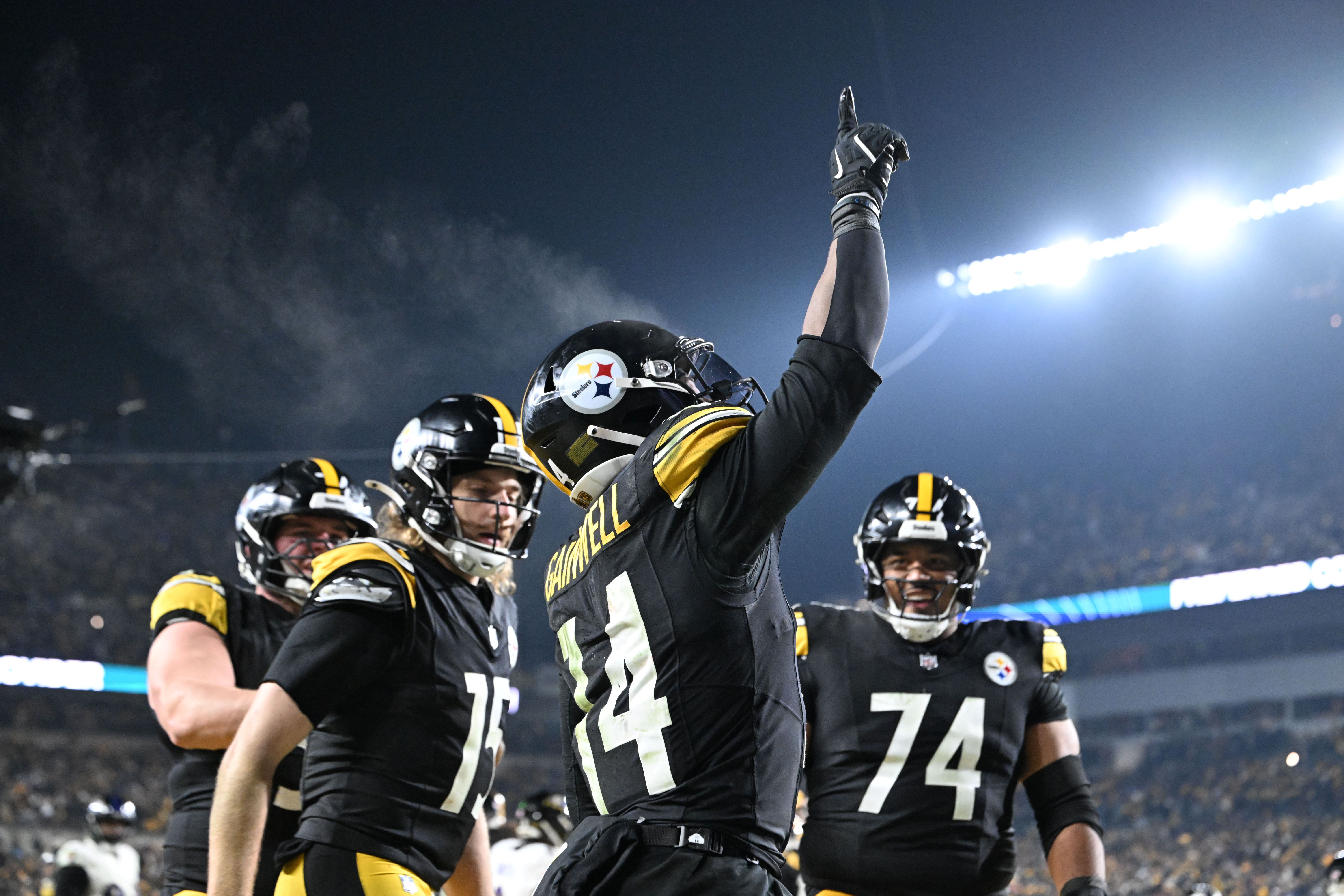 Pittsburgh Steelers running back Kenneth Gainwell (14), who is featured in our Texans vs. Steelers player props, reacts after rushing for a touchdown.