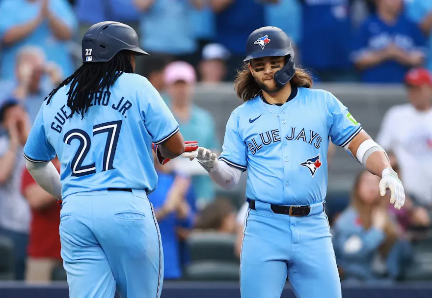 Bo Bichette of the Toronto Blue Jays celebrates with Vladimir Guerrero Jr. after hitting a two-run home run in the second inning as we look at our Blue Jays-Tigers player props.