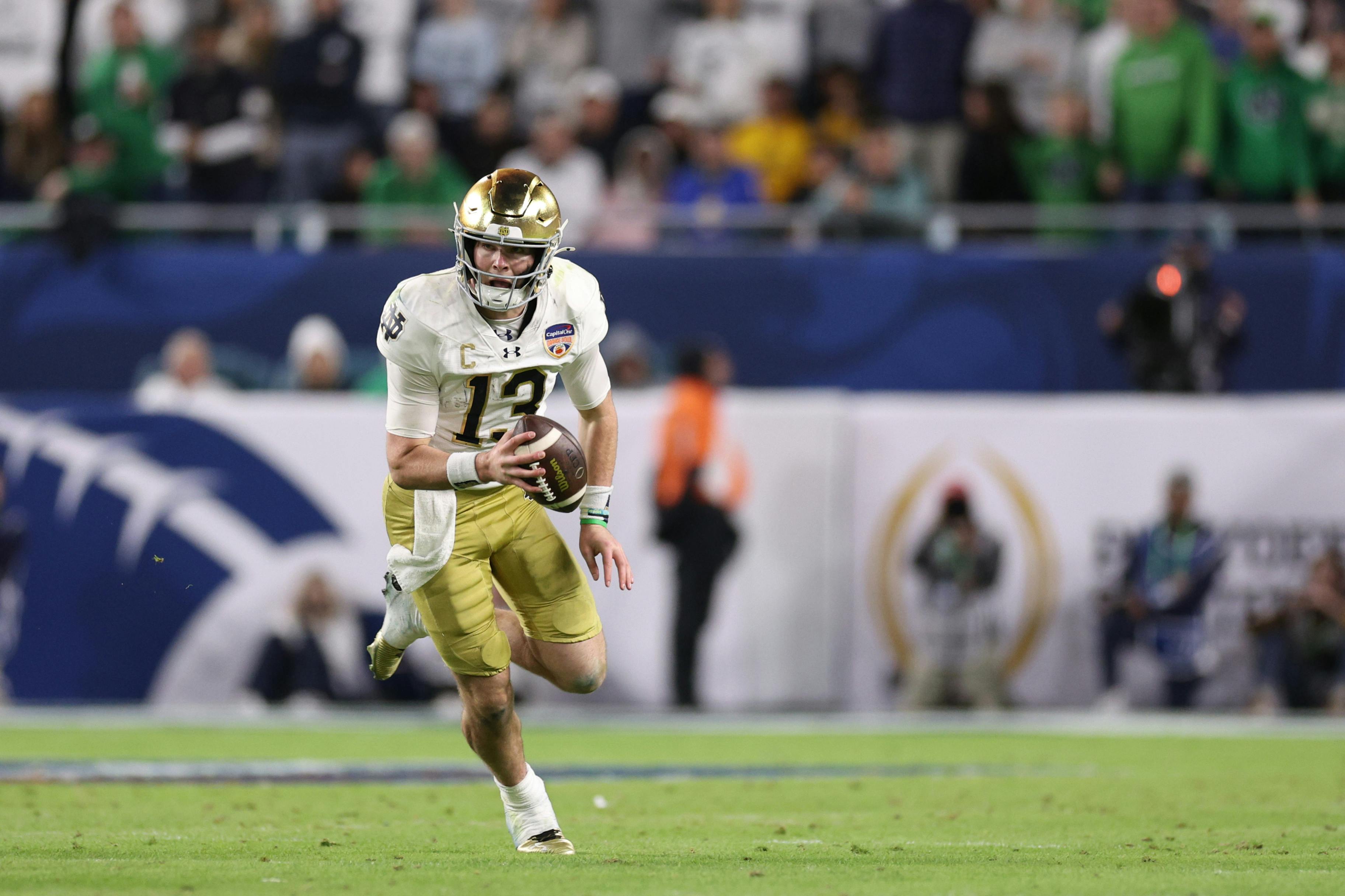 Notre Dame Fighting Irish quarterback Riley Leonard (13) runs the ball as we offer our Notre Dame football preview.