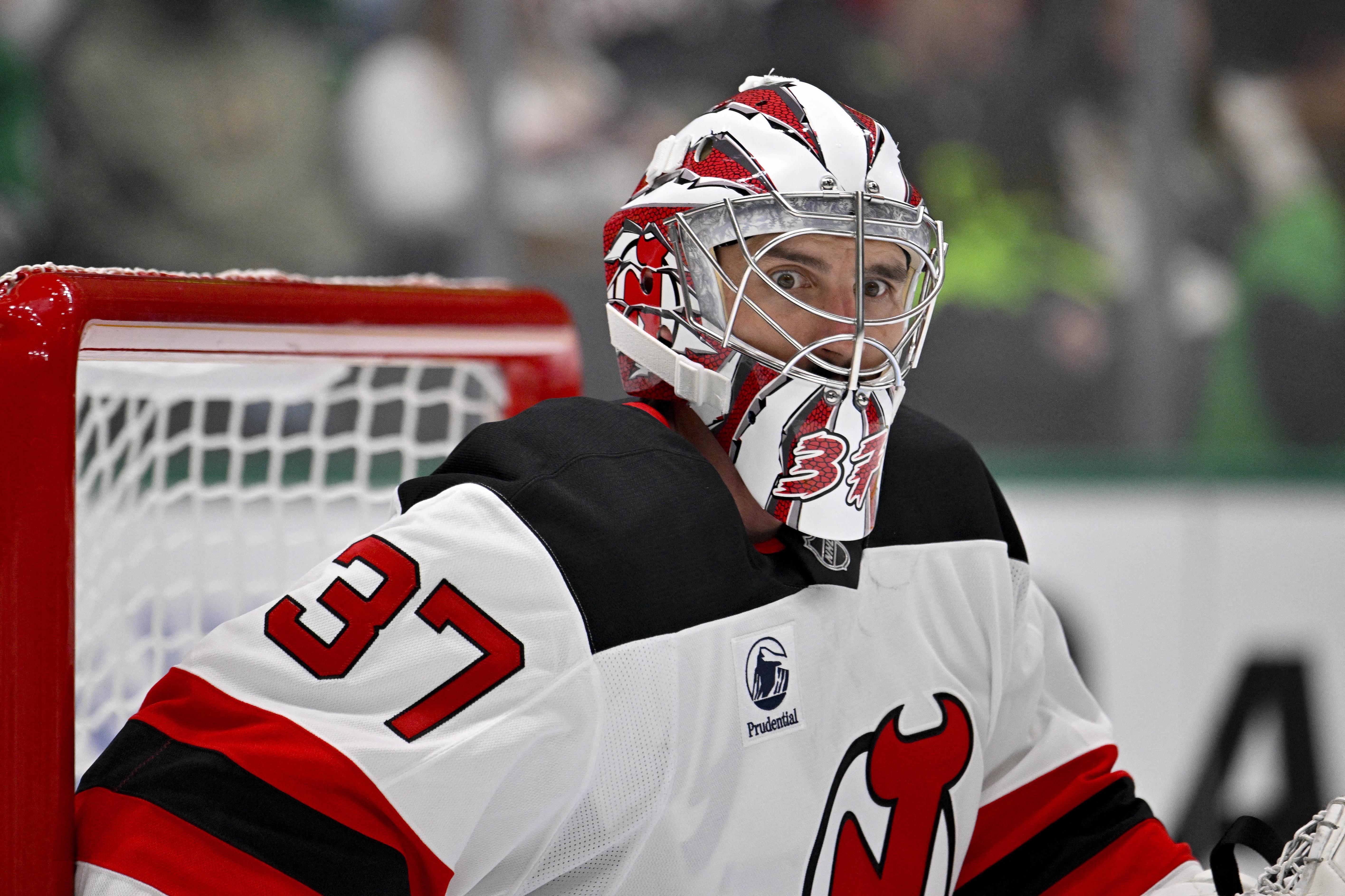 New Jersey Devils goaltender Connor Hellebuyck looks on as we provide our NHL predictions today.