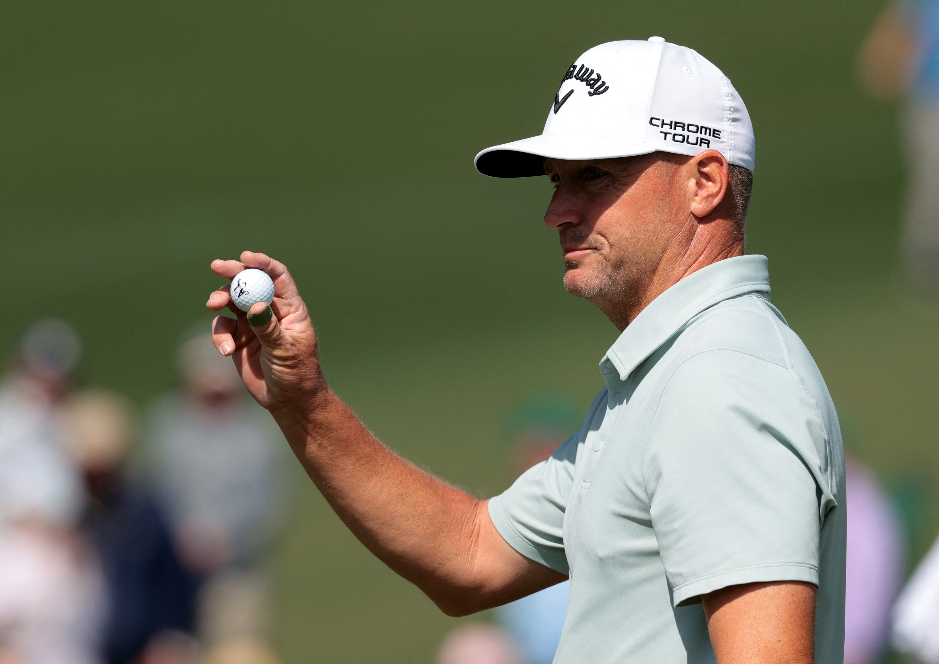 Alex Noren reacts after holing a putt at the Masters, as we look at how prediction markets are reshaping masters betting. 