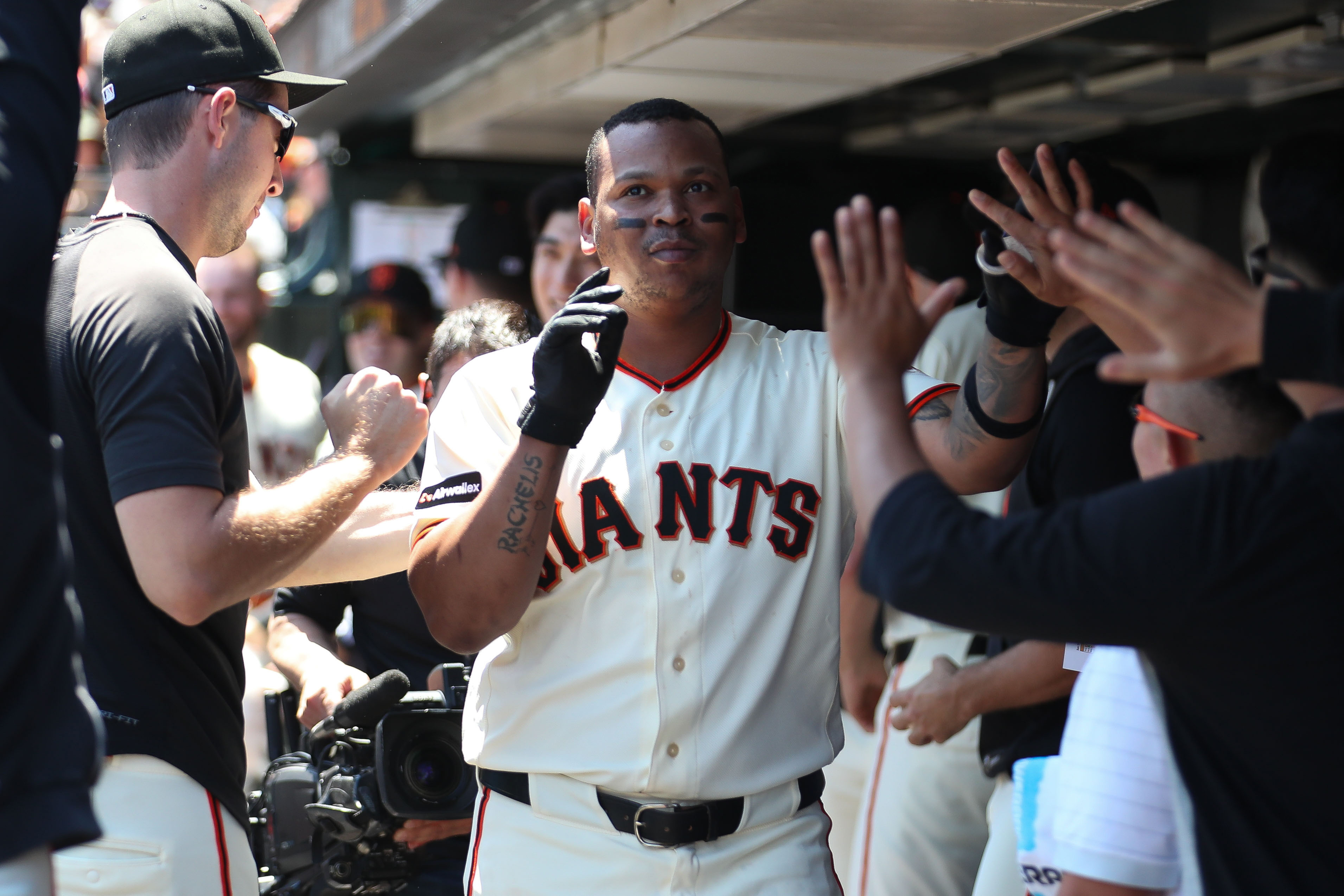  San Francisco Giants first baseman Rafael Devers - who's featured in my Giants vs. Dodgers predictions - high-fives his teammates. 