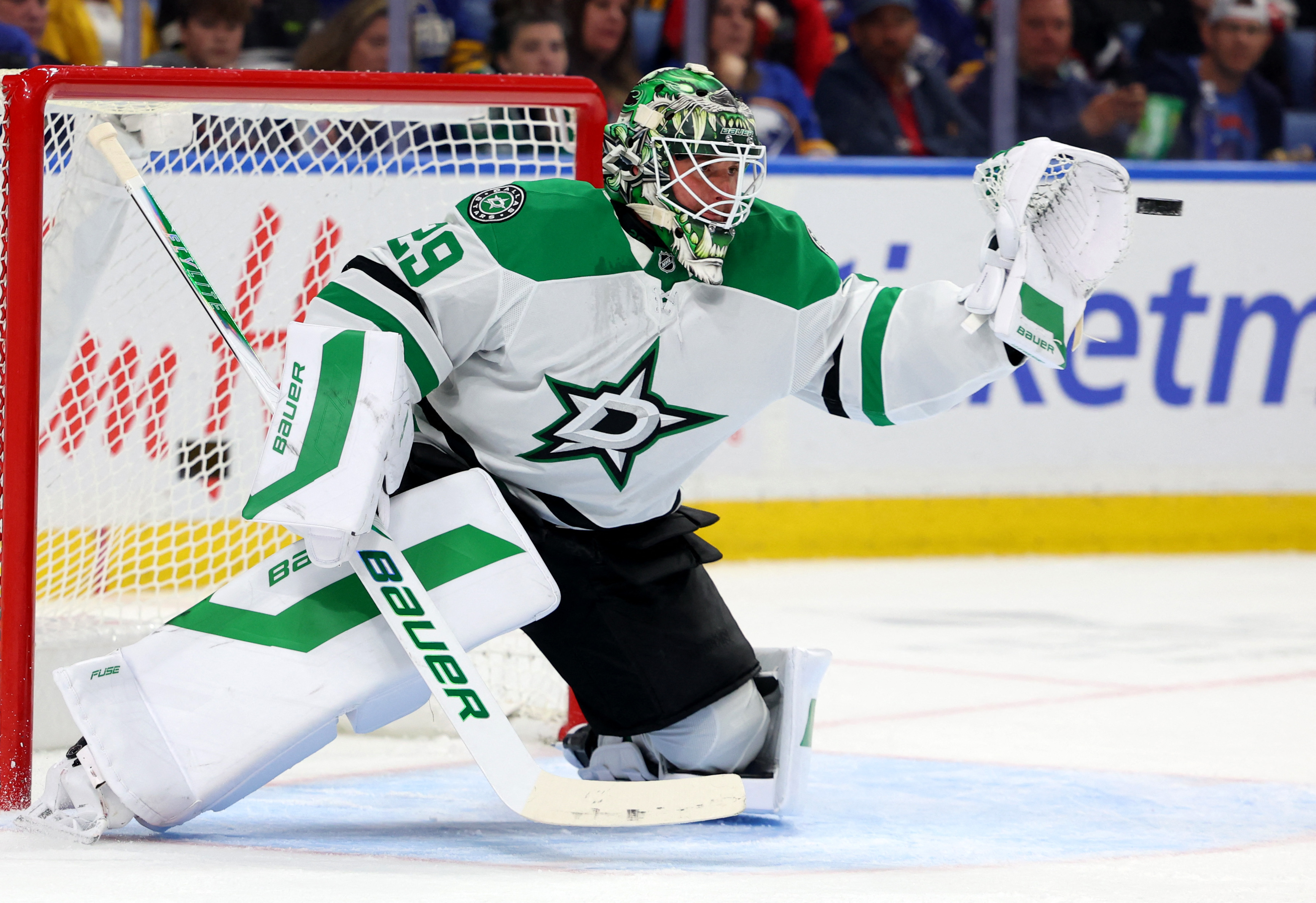 Dallas Stars goaltender Jake Oettinger (29) makes a glove save as we provide our Avalanche vs. Stars prediction.