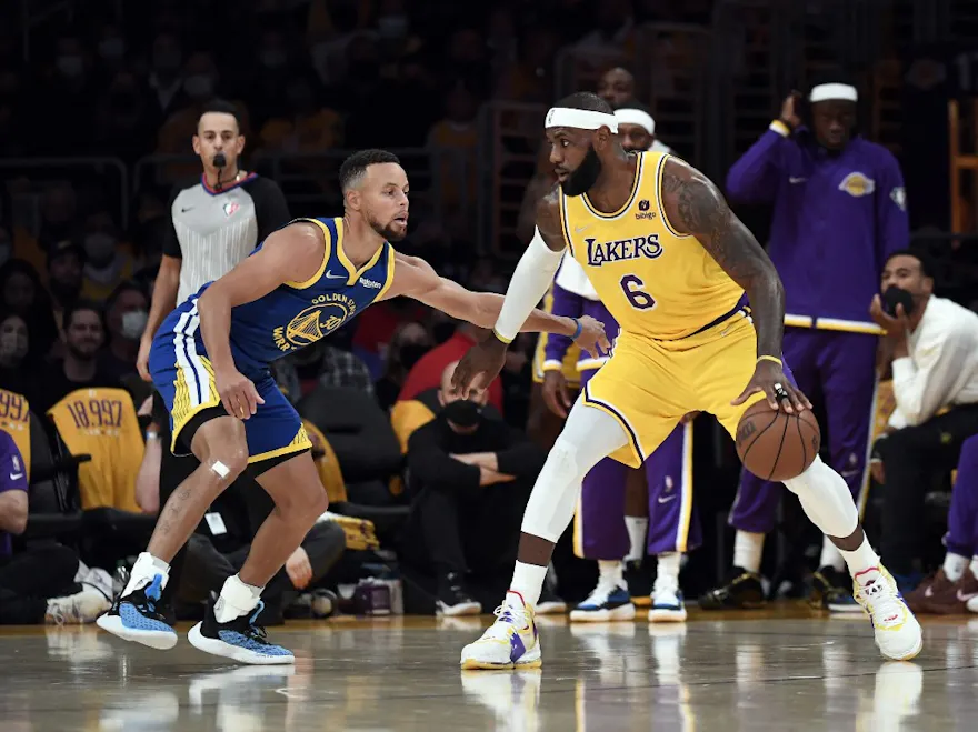 LeBron James of the Los Angeles Lakers controls the ball as we look at our top Lakers-Warriors SGP picks.