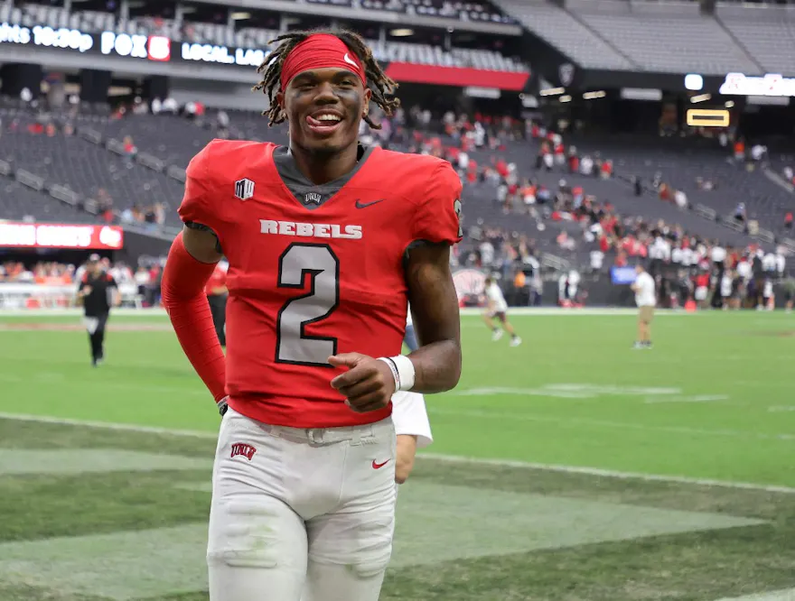 Quarterback Doug Brumfield of the UNLV Rebels smiles as he leaves the field after the Rebels' 52-21 victory over the Idaho State Bengals at Allegiant Stadium on August 27, 2022 in Las Vegas, Nevada.