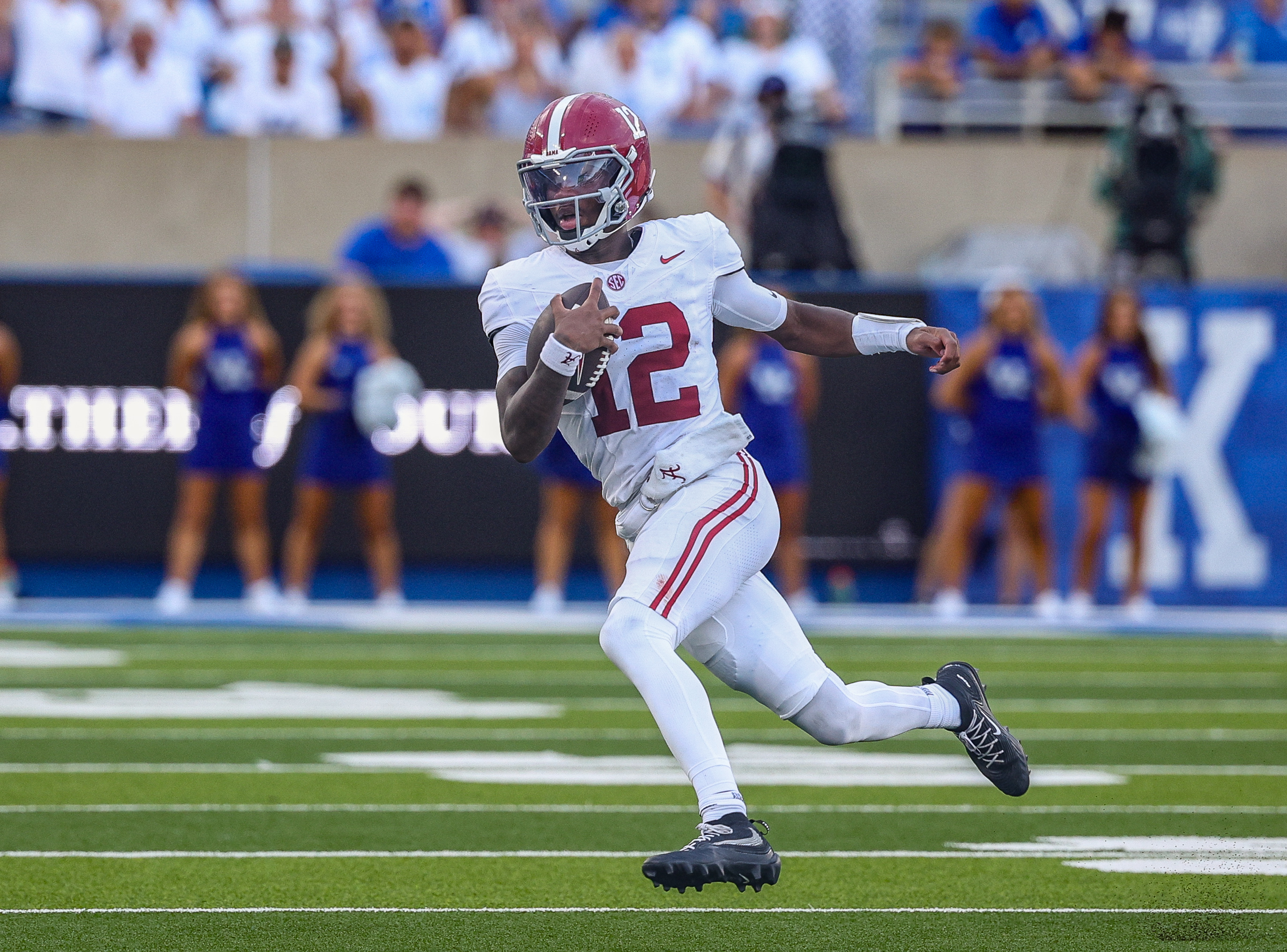 Alabama QB Keelon Russell (12) heads to the sidelines as he is featured in our Florida State vs. Alabama expert picks.