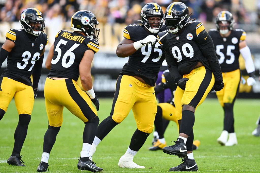 Minkah Fitzpatrick #39 of the Pittsburgh Steelers, Alex Highsmith #56 of the Pittsburgh Steelers and Keeanu Benton #95 of the Pittsburgh Steelers celebrate as we make our Steelers vs. Bills prediction and pick for Sunday's game on NFL Wild Card Weekend.