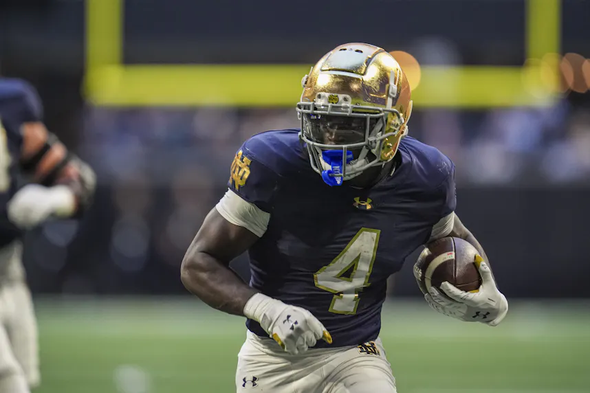 Notre Dame Fighting Irish running back Jeremiyah Love runs, as we offer our Indiana vs. Notre Dame prediction tonight for the first round of the College Football Playoff.