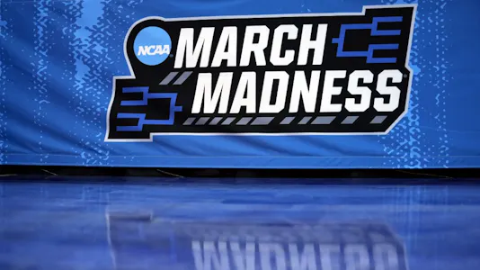 A detailed view of the March Madness logo is seen prior to the first round game between the Utah State Aggies and the Missouri Tigers in the NCAA Men's Basketball Tournament at Golden 1 Center on March 16, 2023 in Sacramento, California.