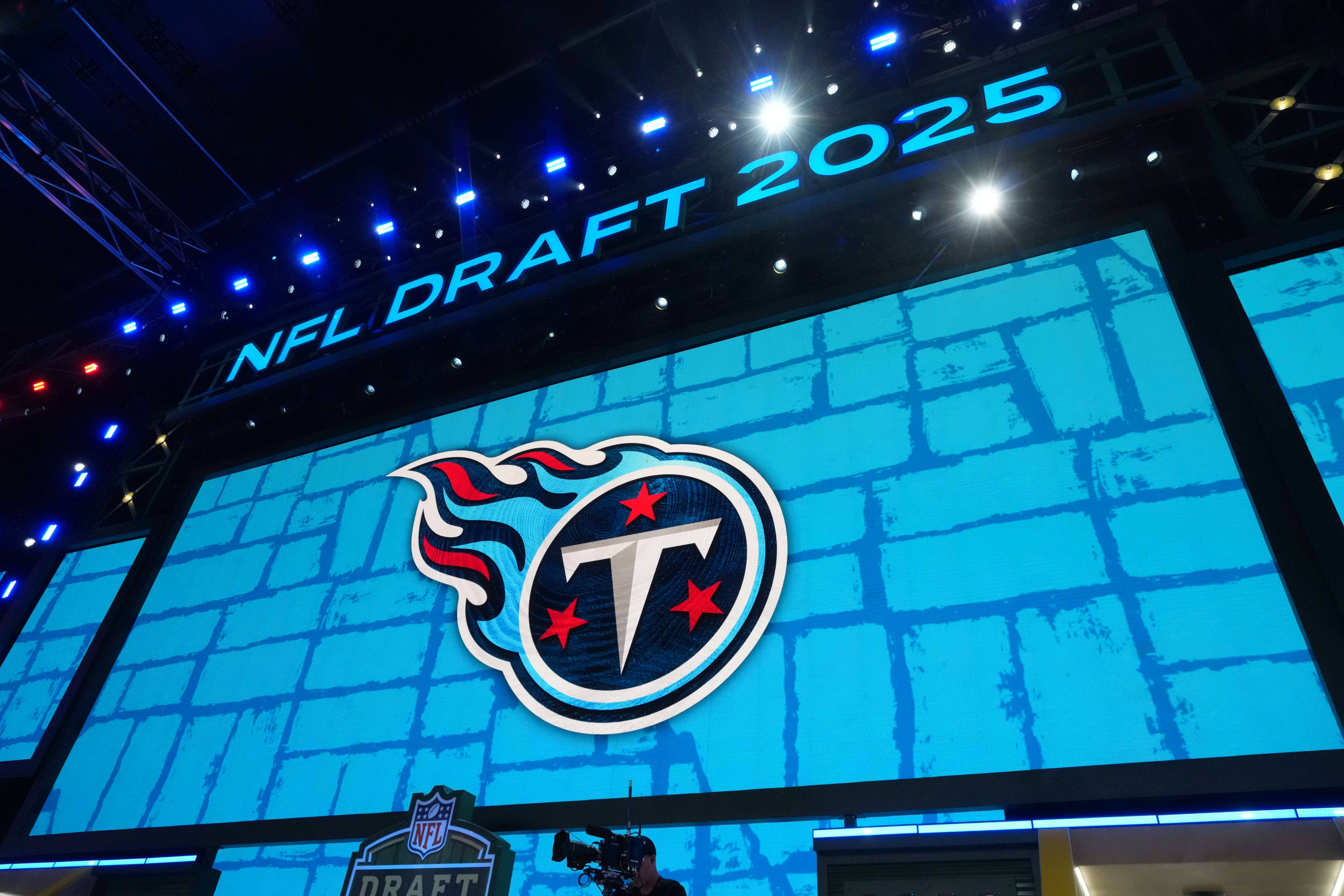 The Tennessee Titans logo is projected on the video board during the NFL Draft at Lambeau Field.