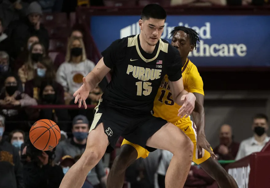 Zach Edey #15 of the Purdue Boilermakers has the ball knocked away by Charlie Daniels #15 of the Minnesota Golden Gophers in the first half of the game at Williams Arena on Feb. 2, 2022.