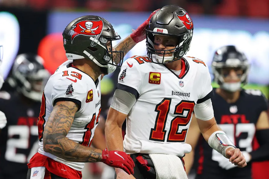 Tom Brady of the Tampa Bay Buccaneers celebrates with Mike Evans after a touchdown pass during the second quarter against the Atlanta Falcons at Mercedes-Benz Stadium. Photo by Kevin C. Cox/Getty Images via AFP.