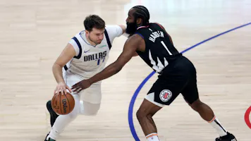 Luka Doncic of the Dallas Mavericks drives to the basket on James Harden of the LA Clippers during the first half at Crypto.com Arena. We're backing Doncic in our Clippers vs. Mavericks player props.