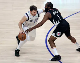 Luka Doncic of the Dallas Mavericks drives to the basket on James Harden of the LA Clippers during the first half at Crypto.com Arena. We're backing Doncic in our Clippers vs. Mavericks player props.