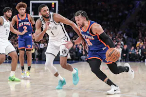 New York Knicks guard Jalen Brunson drives past Brooklyn Nets forward Mikal Bridges in the third quarter at Madison Square Garden. The Knicks are rising by the 2025 NBA Championship Odds after acquiring Bridges. 