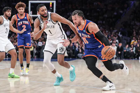 New York Knicks guard Jalen Brunson drives past Brooklyn Nets forward Mikal Bridges in the third quarter at Madison Square Garden. The Knicks are rising by the 2025 NBA Championship Odds after acquiring Bridges. 