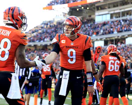 Joe Burrow of the Cincinnati Bengals celebrates his touchdown run with Joe Mixon during the first quarter against the Pittsburgh Steelers at Paul Brown Stadium in Cincinnati, Ohio. Photo by Justin Casterline/Getty Images via AFP.