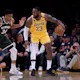 LeBron James of the Los Angeles Lakers backs in on Giannis Antetokounmpo of the Milwaukee Bucks during a game in Los Angeles, California. Photo by Harry How /Getty Images via AFP.