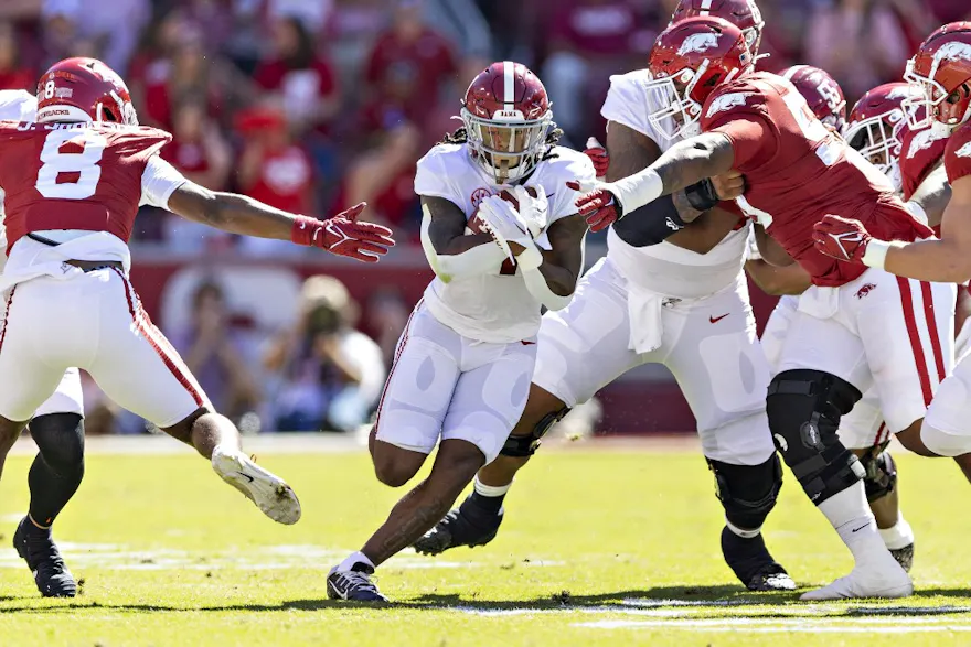 Jahmyr Gibbs of the Alabama Crimson Tide runs the ball up the middle in the first half of a game against the Arkansas Razorbacks at Donald W. Reynolds Razorback Stadium on October 01, 2022 in Fayetteville, Arkansas.