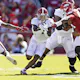 Jahmyr Gibbs of the Alabama Crimson Tide runs the ball up the middle in the first half of a game against the Arkansas Razorbacks at Donald W. Reynolds Razorback Stadium on October 01, 2022 in Fayetteville, Arkansas.