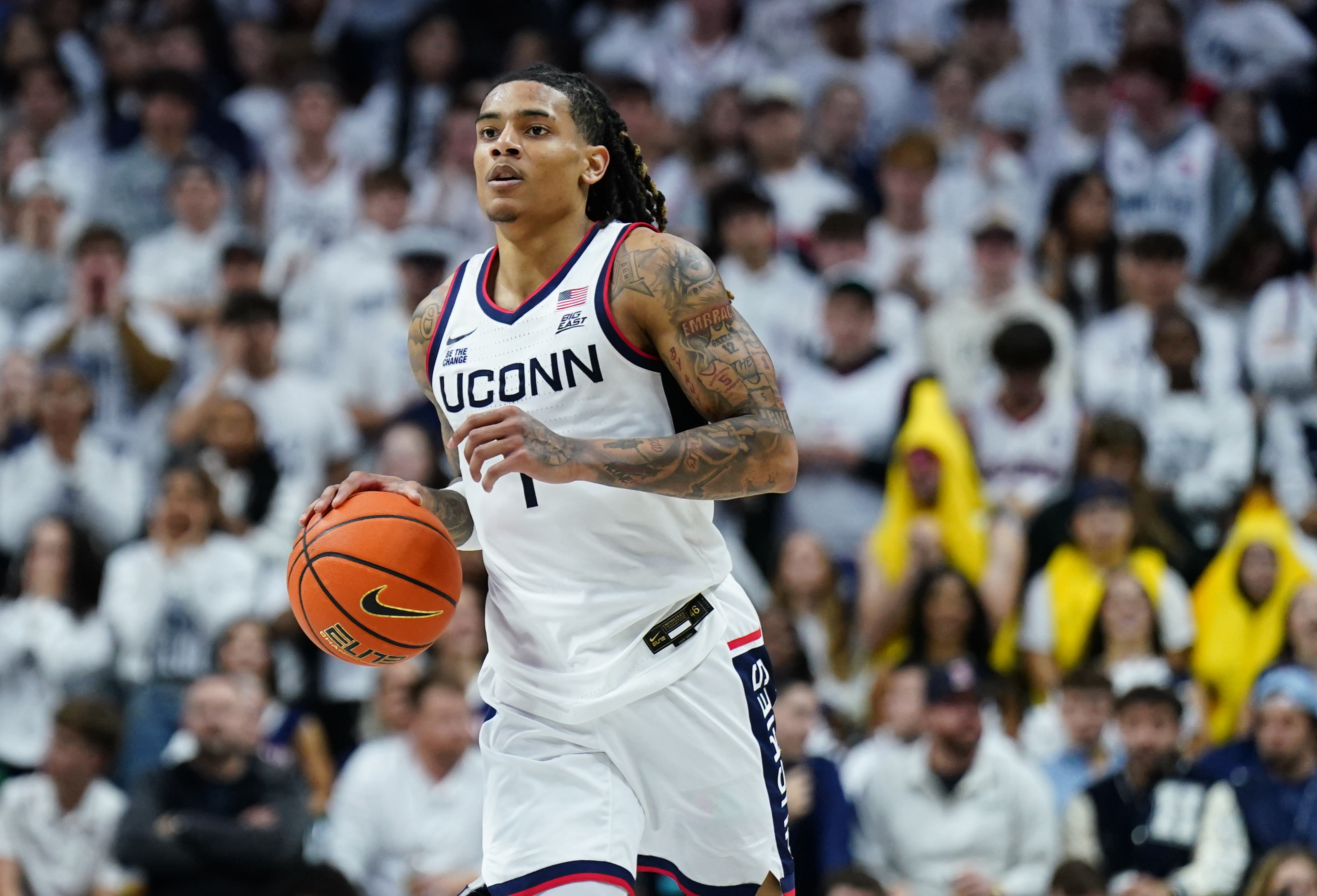 UConn Huskies guard Solo Ball (1) returns the ball as we dive into our BYU vs. UConn prediction, betting odds, and expert picks.