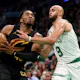 Donovan Mitchell (45) of the Cleveland Cavaliers drives to the basket against Derrick White (9) of the Boston Celtics, as we offer our best Cavaliers vs. Celtics player props for Game 2 on Thursday at TD Garden in Boston.