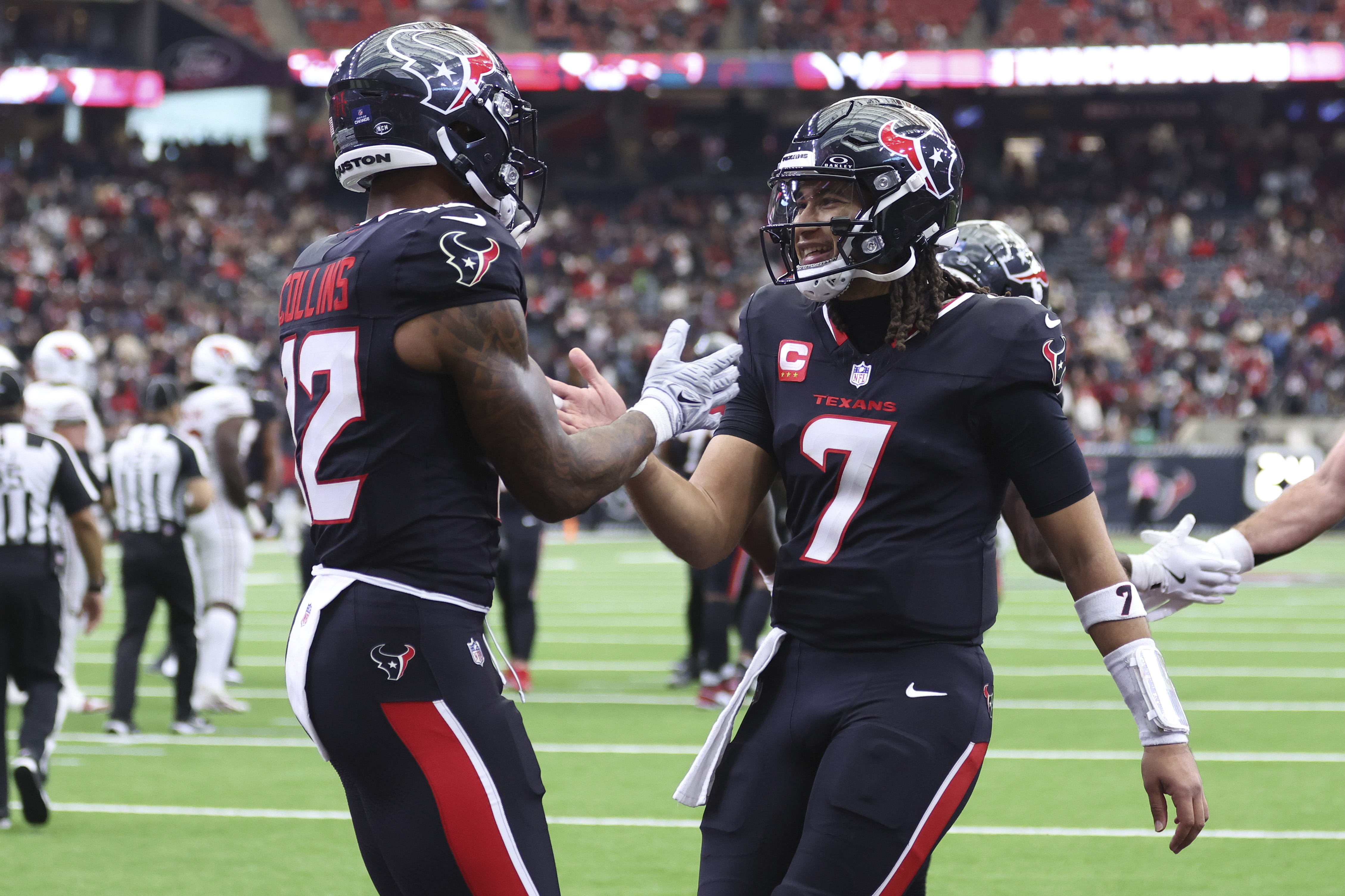 Houston Texans quarterback C.J. Stroud (7) celebrates with wide receiver Nico Collins (12) as we offer our anytime touchdown scorer predictions.