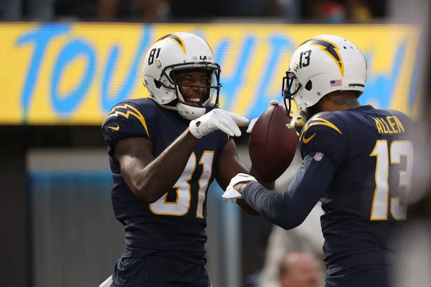 Mike Williams of the Los Angeles Chargers celebrates his touchdown with Keenan Allen against the Seattle Seahawks at SoFi Stadium on Oct. 23, 2022 in Inglewood, California.