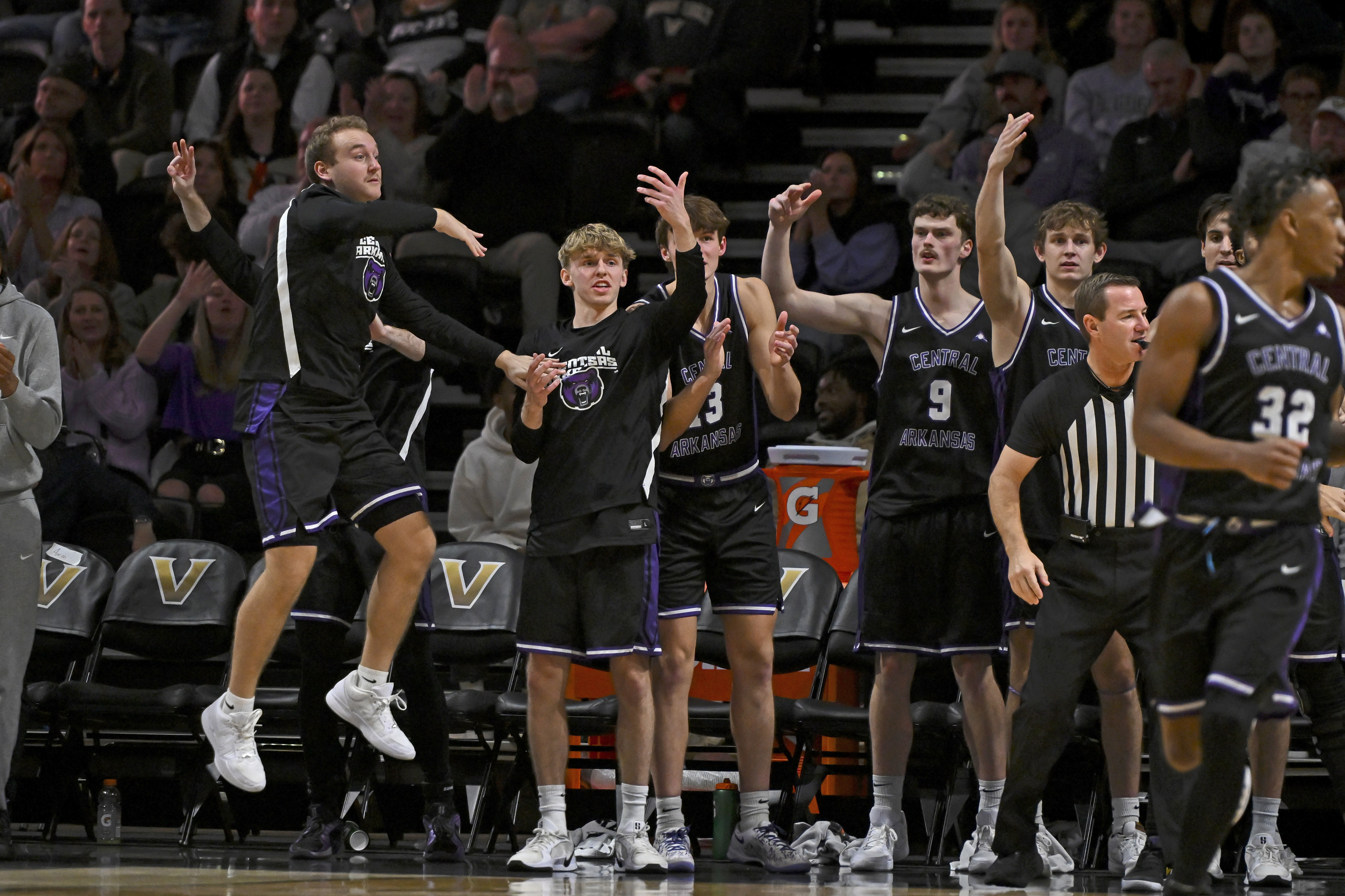 The Central Arkansas bench reacts after a made three as we look at our Queens vs. Central Arkansas prediction