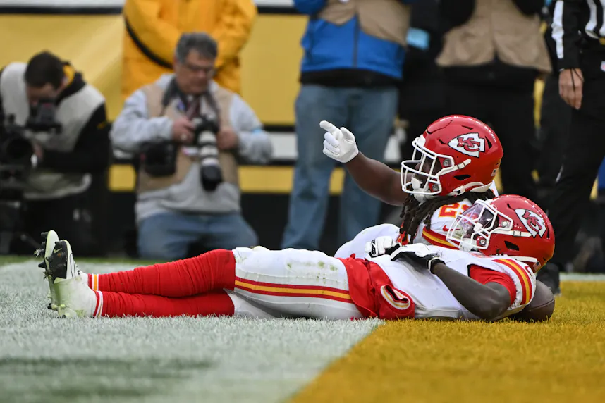 Kansas City Chiefs running back Kareem Hunt and wide receiver Xavier Worthy celebrate a touchdown as we make our best Texans vs. Chiefs player prop picks & touchdown predictions.