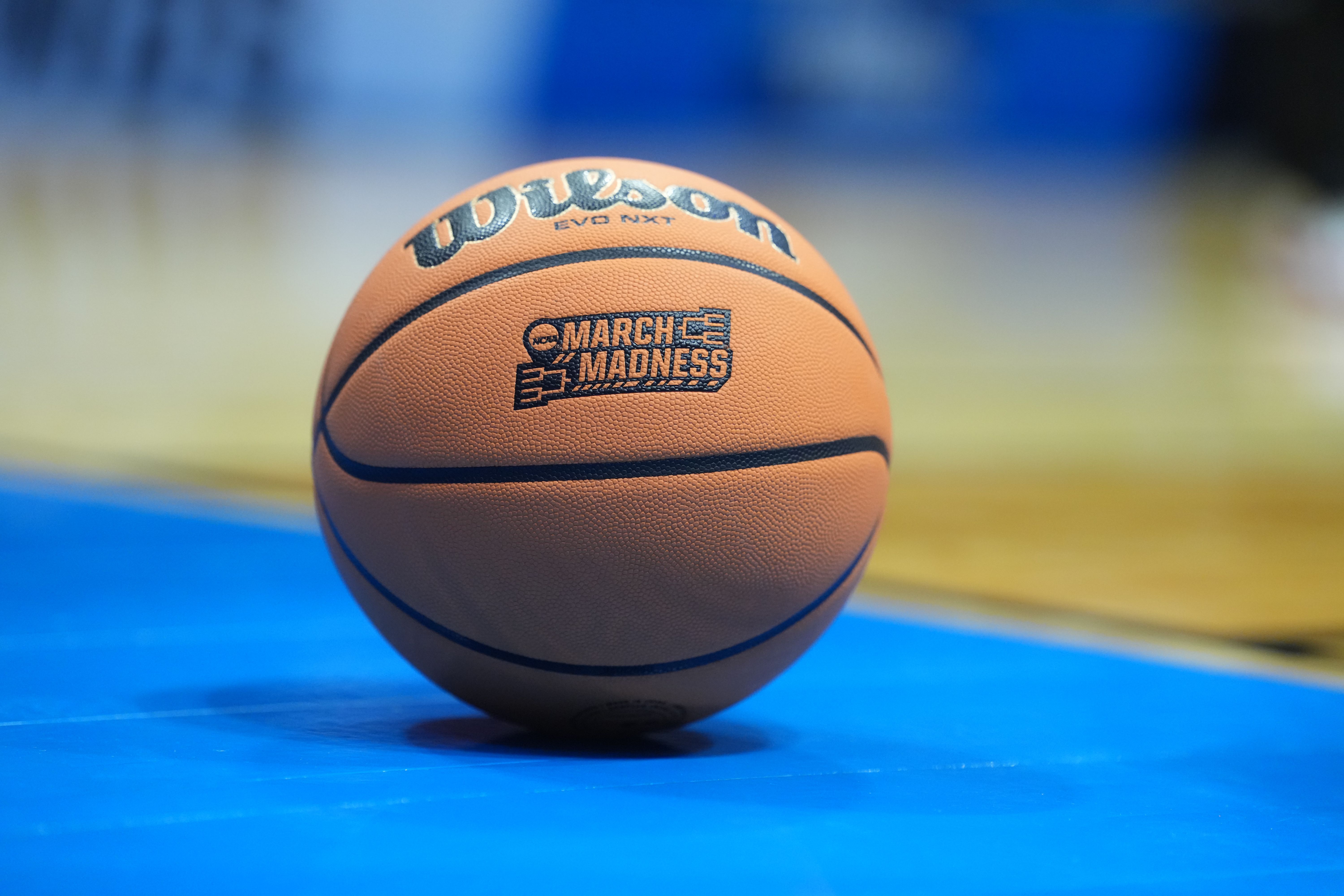 A Wilson Evo NXT basketball with the March Madness logo as we look at how prediction market apps outperformed traditional sportsbooks.