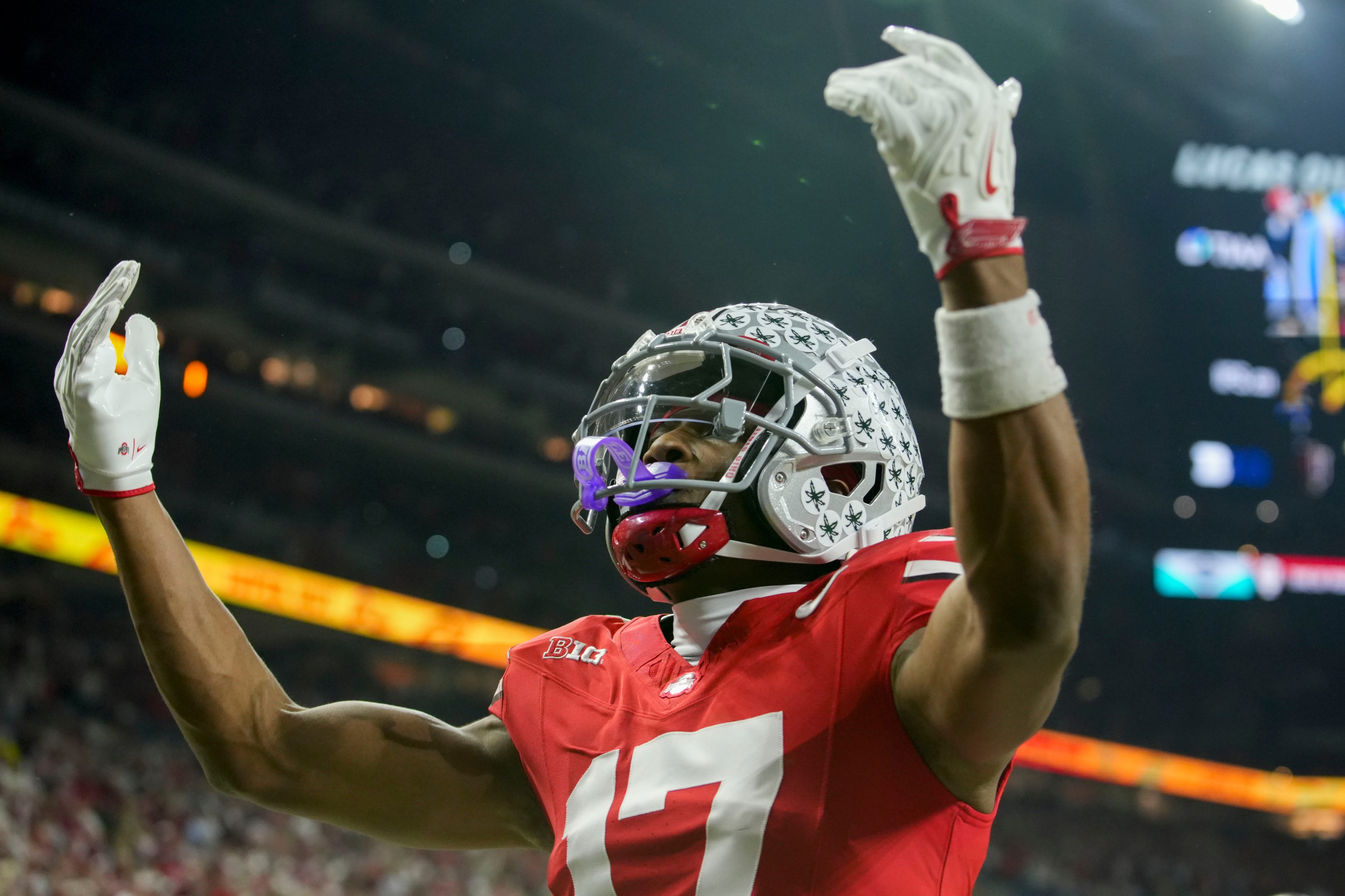 Ohio State Buckeyes wide receiver Carnell Tate (17) celebrates a touchdown as he is featured in our Miami vs. Ohio State expert picks for the Cotton Bowl.