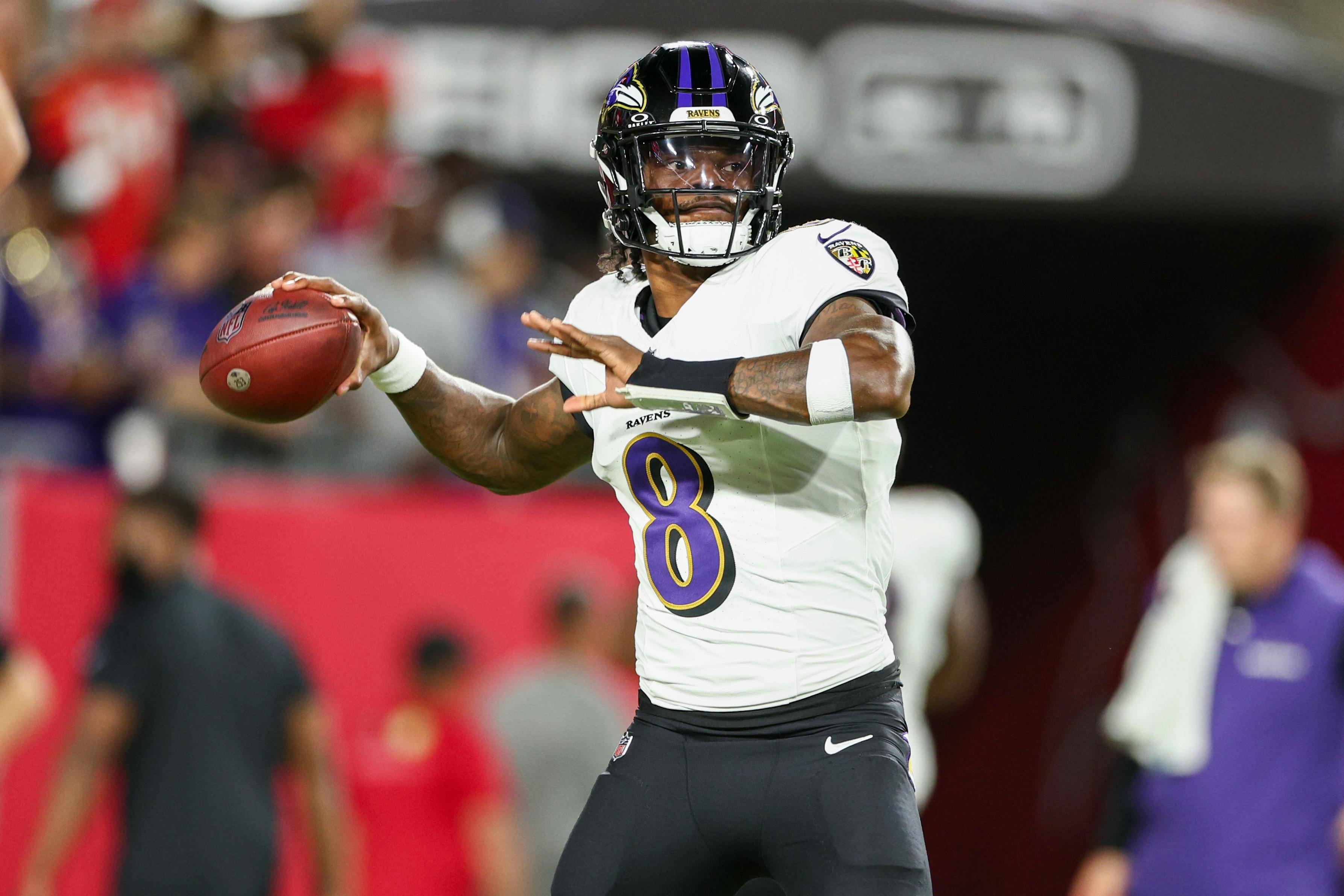 Baltimore Ravens quarterback Lamar Jackson warms up as we break down the latest 2025 Super Bowl odds after NFL Week 12.