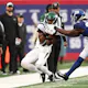 Garrett Wilson #17 of the New York Jets catches a pass over Deonte Banks #25 of the New York Giants as we look at New York State's record-setting handle in October 2023