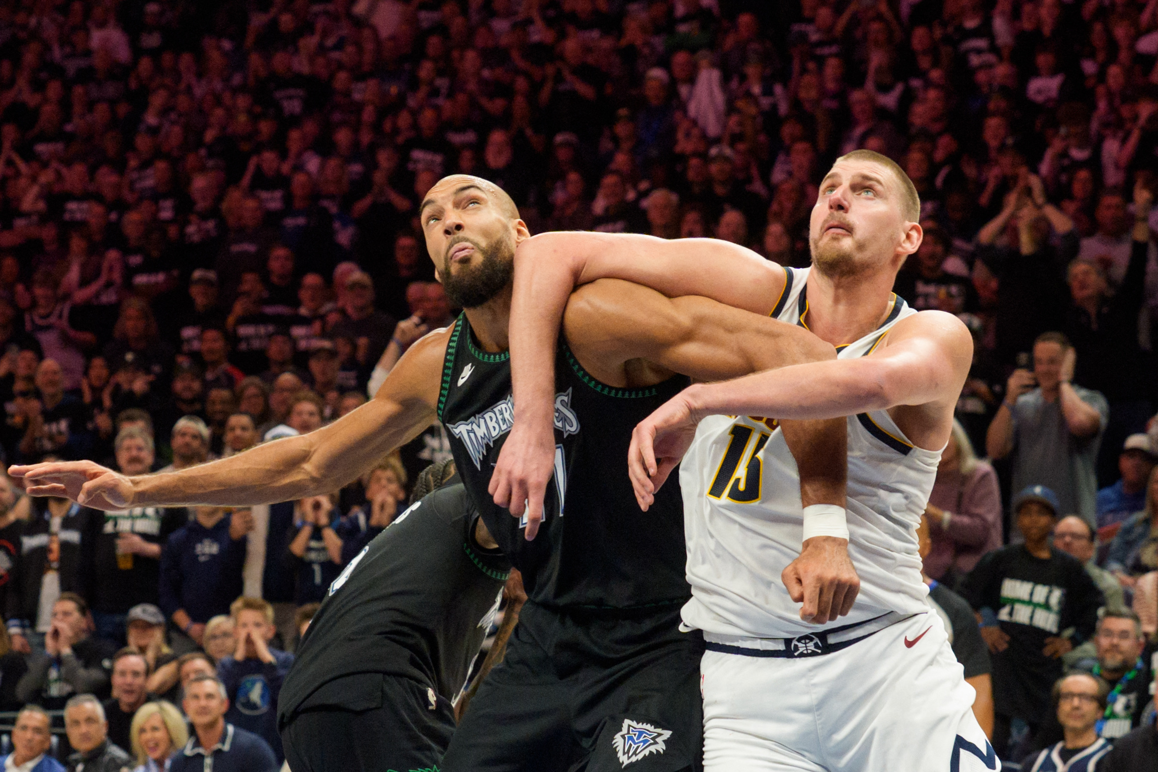 Minnesota Timberwolves center Rudy Gobert (27) and Denver Nuggets center Nikola Jokic (15) position themselves for a rebound as we provide our Timberwolves vs. Nuggets Game 5 player props.