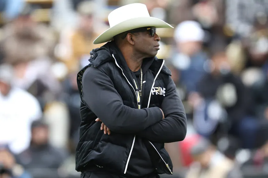 Head coach Deion Sanders of the Colorado Buffaloes watches as his team warms up as we look at our Colorado betting preview