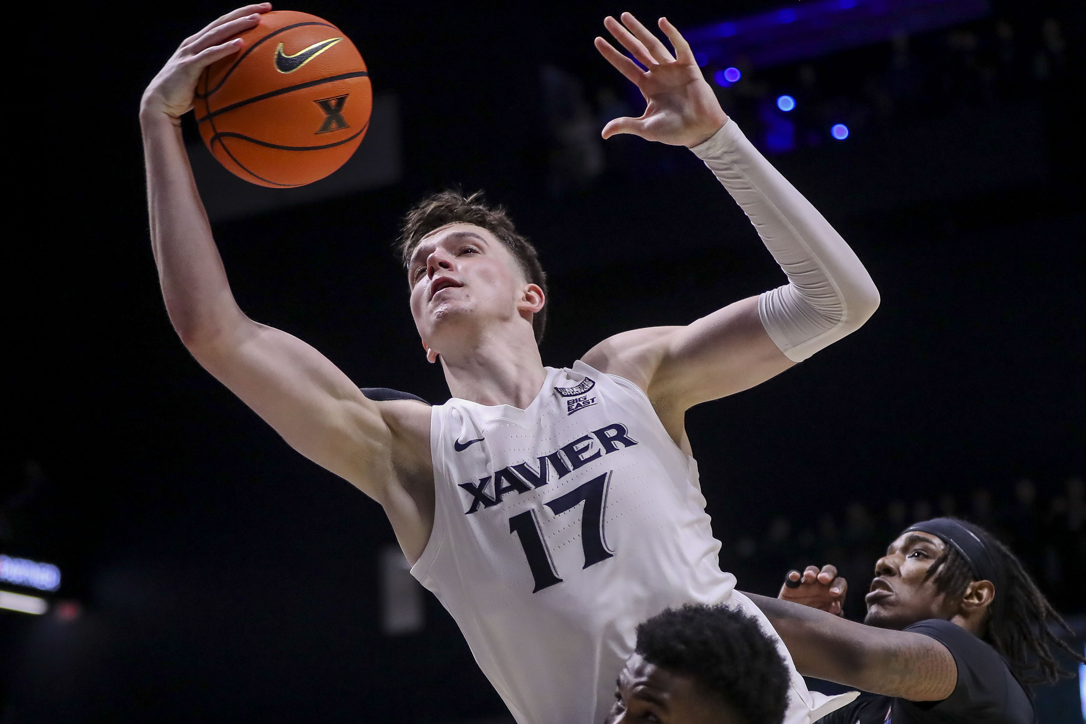 Xavier Musketeers forward Lazar Djokovic (17) grabs the rebound as he is featured in our VCU vs North Carolina prediction.