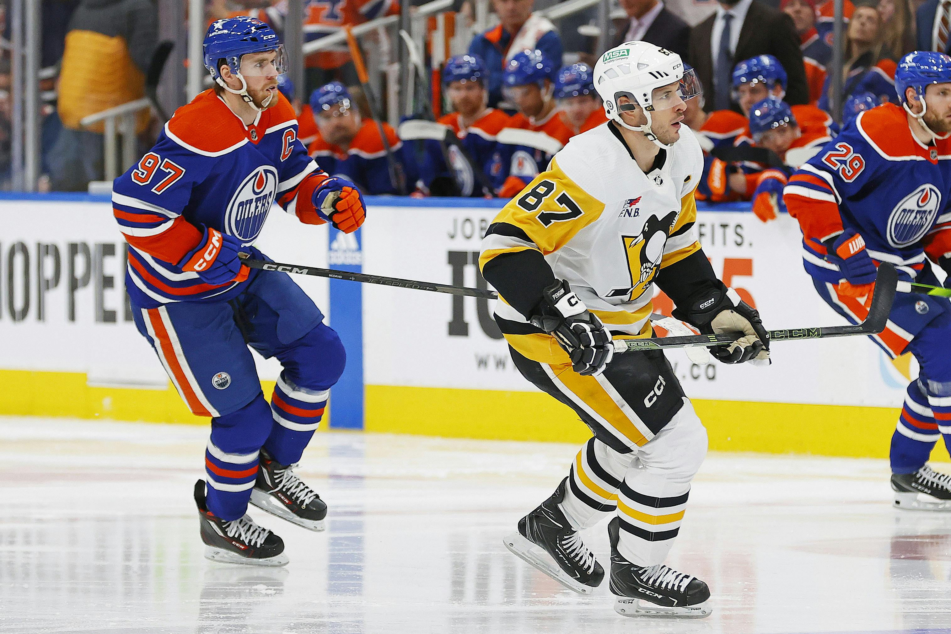 Pittsburgh Penguins forward Sidney Crosby and Edmonton Oilers forward Connor McDavid follow the play<br>