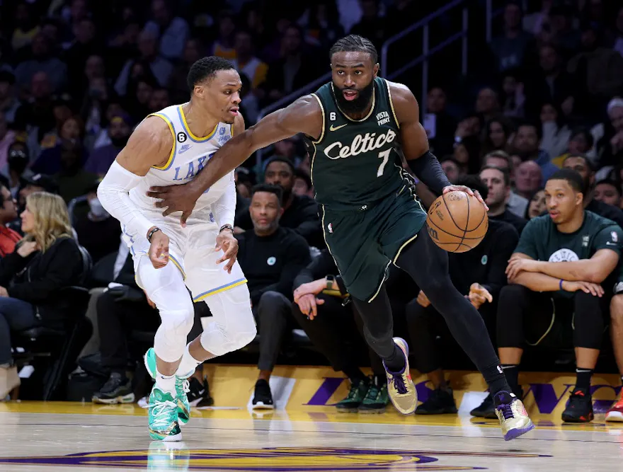 Jaylen Brown of the Boston Celtics drives past Russell Westbrook of the Los Angeles Lakers during a 122-118 Celtics overtime win at Crypto.com Arena.