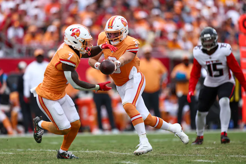 Tampa Bay Buccaneers quarterback Baker Mayfield hands off to running back Bucky Irving as we make our Buccaneers vs. Chiefs early picks.