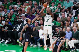 Boston Celtics guard Jaylen Brown shoots against Dallas Mavericks forward P.J. Washington in the fourth quarter during Game 1 of the 2024 NBA Finals at TD Garden. We're backing Brown in our Mavericks vs. Celtics Parlay. 