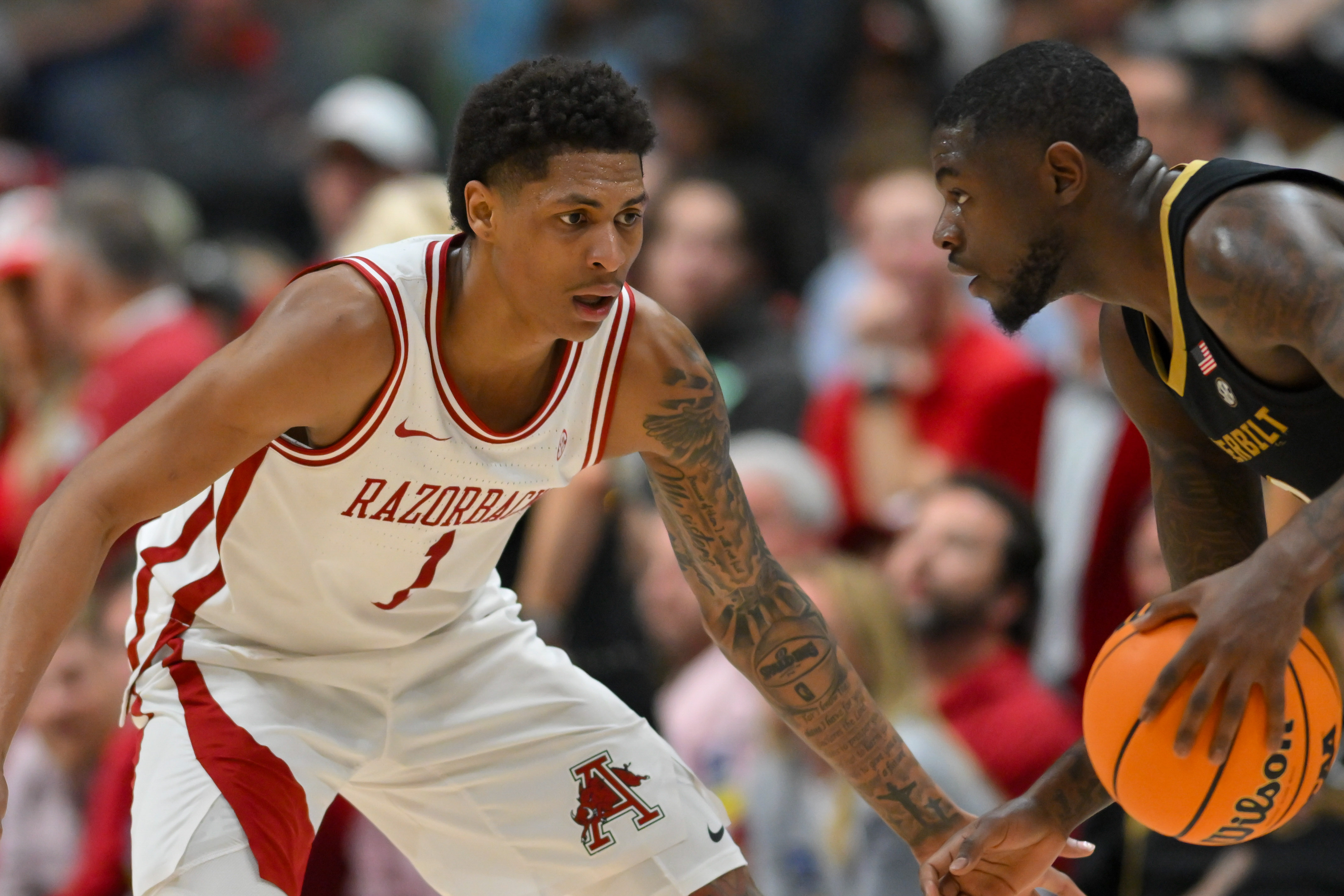 Arkansas Razorbacks Meleek Thomas guards as we make our best Arkansas vs. Arizona prediction. 