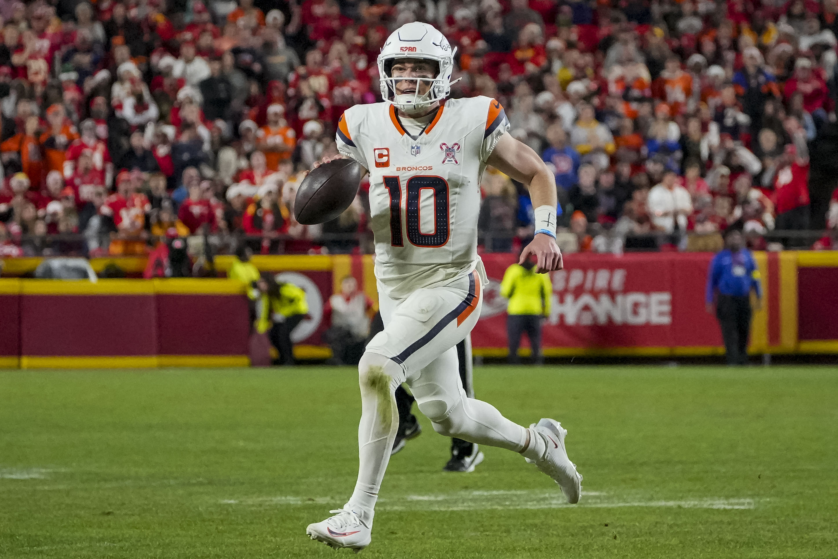 Denver Broncos quarterback Bo Nix runs the ball as we make our best Bills vs. Broncos prediction based on the early odds.