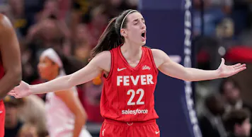 Indiana Fever guard Caitlin Clark (22) yells to the referee as we offer our best Mystics vs. Fever prediction and expert picks for Wednesday's WNBA matchup at Gainbridge Fieldhouse in Indianapolis.