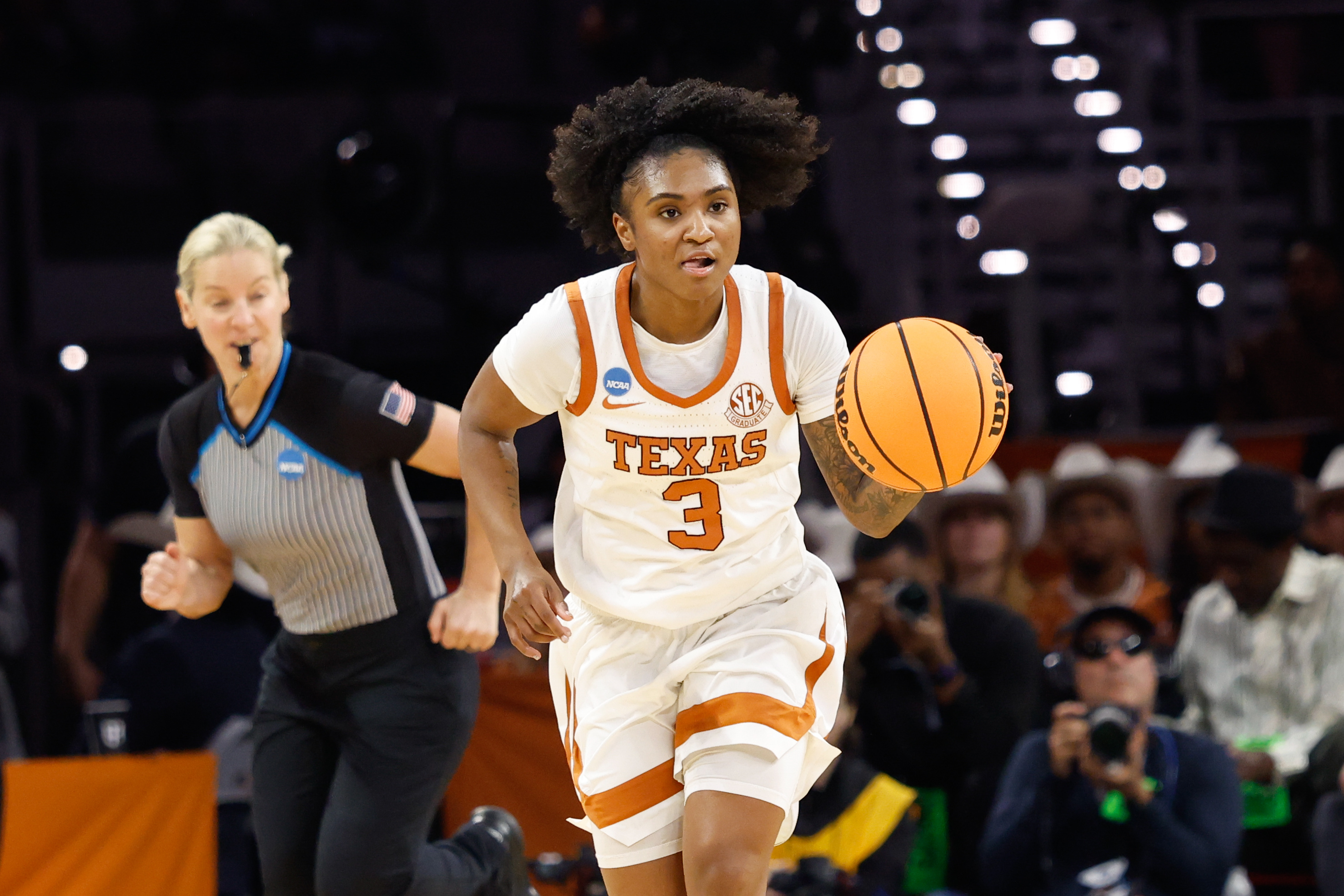 Texas Longhorns guard Rori Harmon dribbles the ball up court as we make our best Michigan vs. Texas prediction.