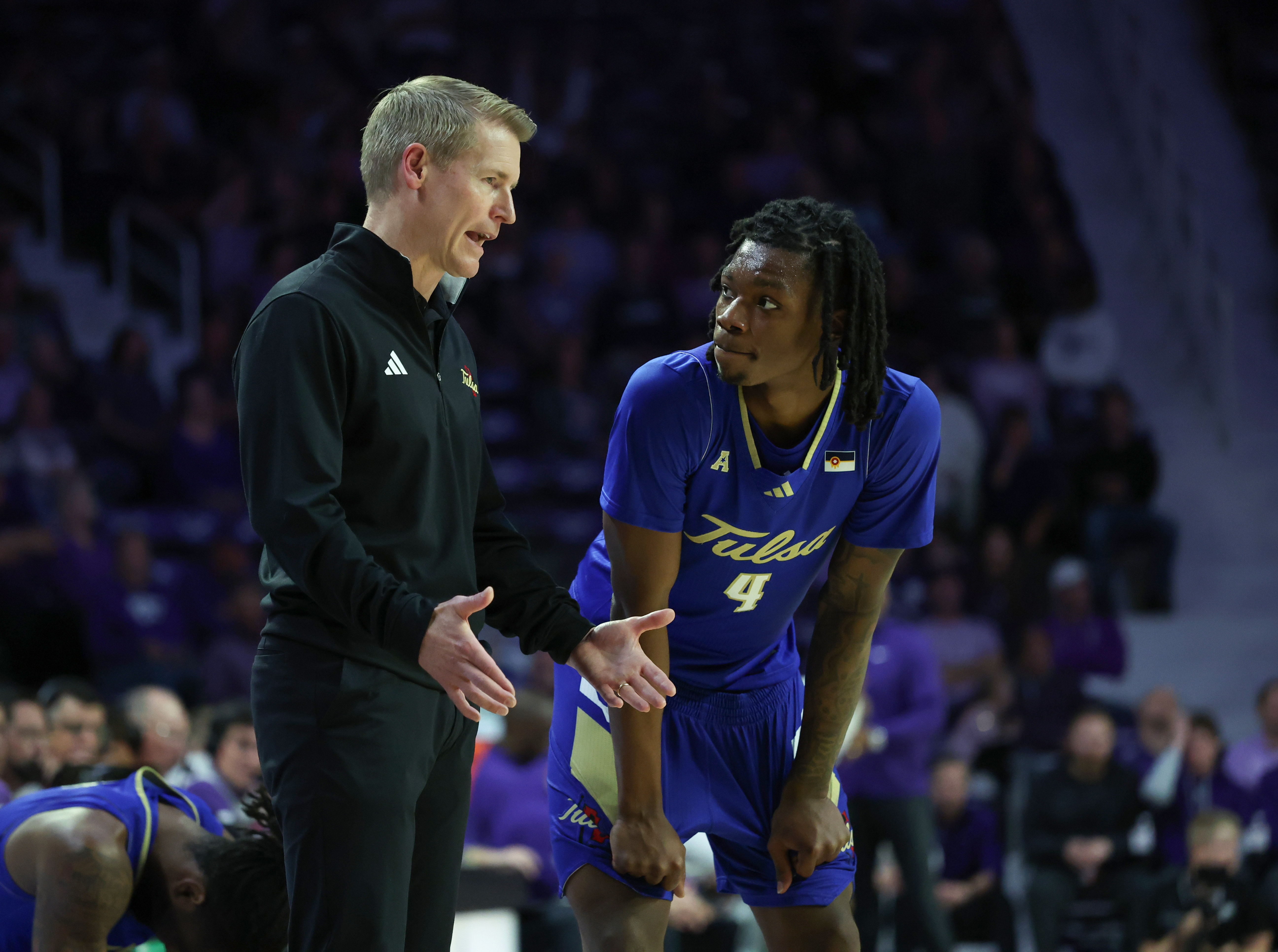 Tulsa Golden Hurricane head coach Eric Konkol talks to guard Myles Rigsby as we make our best Wichita State vs. Tulsa prediction