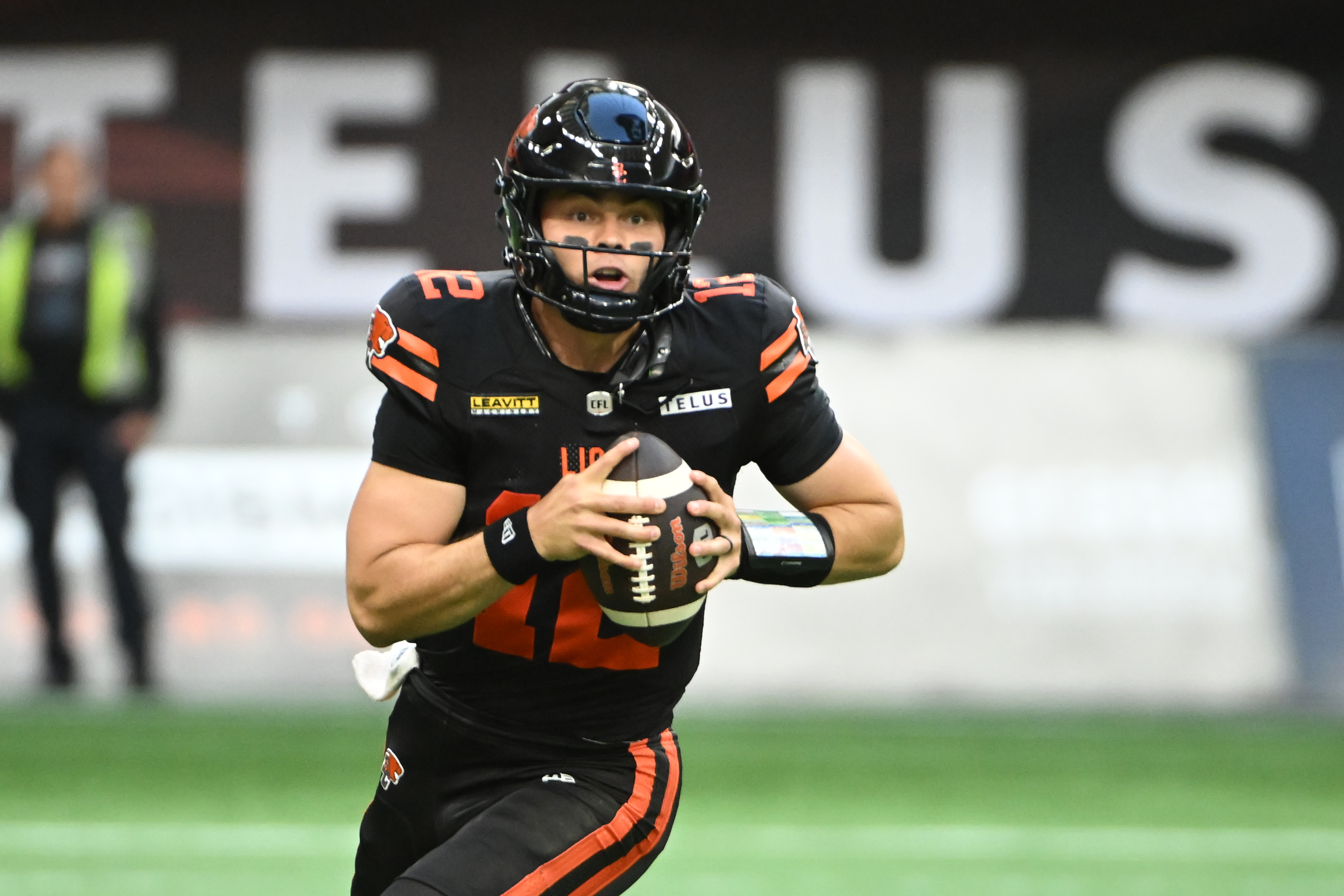 BC Lions quarterback Nathan Rourke (12) looks to pass as we dive into our Lions vs. Roughriders prediction, betting odds, and expert picks for tonight's CFL West final.