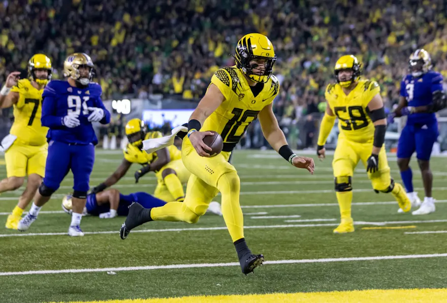 Quarterback Bo Nix of the Oregon Ducks records a touchdown as we look at the latest Pac-12 title odds.